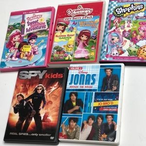 A dvd set with 5 different children's movies including Jonas rockin the hause.